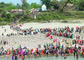Pilgrims take a dip in the Beas at Kalieshwar Mahadev temple in Kangra on Saturday