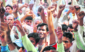 Members of the Lal Jhanda Punjab Bhatha Mazdoor Union raise slogans against the government in Ludhiana on Saturday.