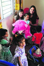 Members of an NGO with the children of women inmates during the launch of the "Satrangi" project at Womens Jail in Ludhiana on Saturday.