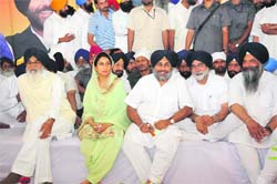 Punjab Chief Minister Parkash Singh Badal, Bathinda MP Harsimrat Badal, Deputy CM Sukhbir Badal and other leaders at SADs conference at Talwandi Sabo on Saturday. A Tribune photo: Pawan sharma