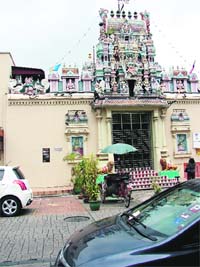 A pedi-cab in front of the Mahamariamma Temple