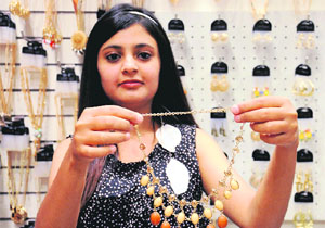 A lady displays one of the creations by Addons.