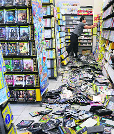 Fallen disks at a rental DVD shop in Awaji, Hyogo prefecture after a 6.0 magnitude quake hit western Japan. No tsunami warning was issued. 