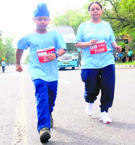 Nine-year-old Alam and his mother from Ludhiana take part in the Chandigarh Marathon on Sunday