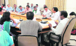Dehradun District Magistrate BVRC Purushottam holds a meeting with representatives of various political parties in Dehradun on Saturday.