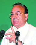 Health Minister Kaul Singh Thakur addresses a press conference at Palampur 