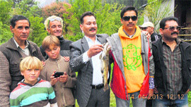 Shamsher Thakur (centre) and Krishan Sandhu with foreign anglers at Kasol in Kullu district on Sunday.