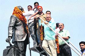 People garland the statue of Dr BR Ambedkar on his 122nd birth anniversary in Jammu on Sunday