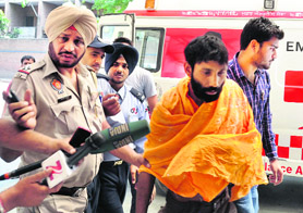 The man who tried to immolate himself being taken to a hospital in Ludhiana on Sunday.