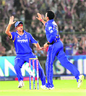S. Sreesanth and Rahul Dravid celebrate a wicket. 