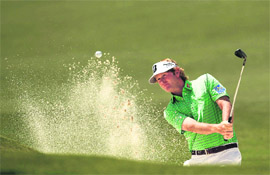 Brandt Snedeker of the U.S. hits from a sand trap on the second hole during the third round of the Masters at the Augusta National Golf Club.