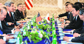 US Secretary of State John Kerry (centre L) speaks with Japanese Foreign Minister Fumio Kishida (centre R) in Tokyo on Sunday.