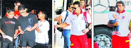 (From left) Cricket fans in a jubilant mood after getting autographs of cricket players; Adam Gilchrist; and (extreme right) Azhar Mehmood of Kings XI Punjab arrive at a hotel in Chandigarh on Monday.