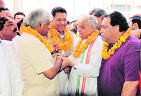 Poll Bonhomie: Senior Congress leader and AICC observer Maj Ved Parkash (retd) with Uttarakhand Planning and Sports Minister Dinesh Aggarwal and Congress mayoral candidate Suryakant Dhasmana during the inauguration of the party election office in Dehradun on Monday