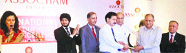 Brig (retd) Satya Dev Singh (second from right) and Naresh Paliwal receive the National Education Execellence Award-2013 from Union Human Resources Development Minister MM Pallam Raju during a programme in Delhi.