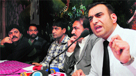 President of the Doctors Association Kashmir Nissar-ul-Hussain addresses a press conference in Srinagar on Monday.