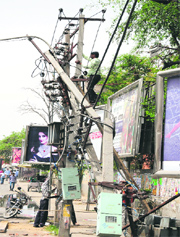 A worker of the Powercom repairs the damaged transformers near Nai Basti, which led to power failure in the area on Tuesday.