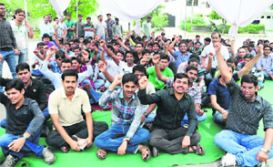 NIPER students hold a protest in front of the gate of the institute in Mohali on Tuesday.