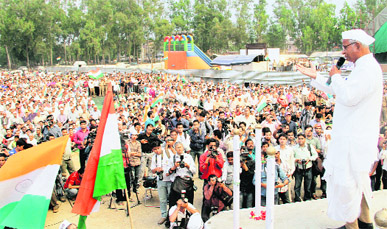 Anti-corruption crusader Anna Hazare addresses a public meeting as part of his Jantantra Yatra at the Parade Ground in Dehradun on Tuesday.