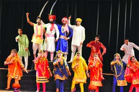 Students perform a dance during the cultural function Rangla Jammu in Katra on Tuesday