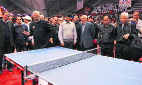 Minister for Sports and Medical Education Taj Mohiuddin plays a table tennis shot during the inaugural session of J&K Bank Veteran National Table Tennis Championship in Srinagar on Tuesday.