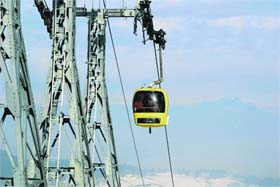 In this file photo, tourists enjoy a gondola ride at a resort in Gulmarg in north Kashmir