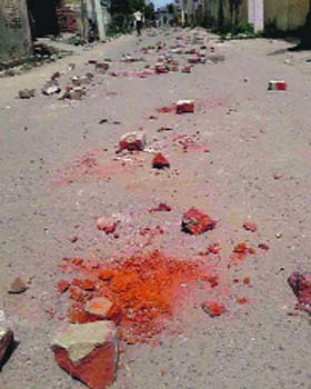 Bricks and stones on the street where the clash took place