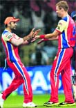 Andrew Mcdonald, Virat Kohli celebrate the wicket of Dardevils.  PTI