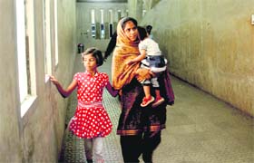 Rafat, along with her children, returns home