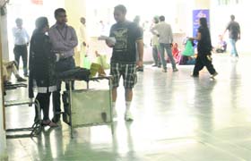 Mandeep Singh asks personnel at a help desk for the way to the research block