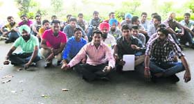 Members of the SOPU stage a protest outside the administrative block of Panjab University in Chandigarh on Wednesday