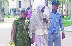 Sompati, along with her son and daughter, returns to a serai on the PGI campus