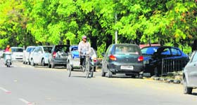 Vehicles parked on a road at Panjab University in Chandigarh on Wednesday