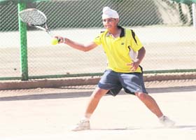 A player returns a shot during a lawn tennis match at Manav Mangal School, Sector 11, Panchkula, on Wednesday