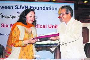 D Sarveswar, secretary, SJVN Foundation-cum-AGM, corporate social responsibility, exchanges the MoU with Madhu Madan, country head, HelpAge India, in Shimla on Wednesday. 