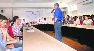 Micheal Ginguld, Director, Strategy and Operations, Rural Broadband, deliveres a lecture at the CUHP in Shahpur on Tuesday. 