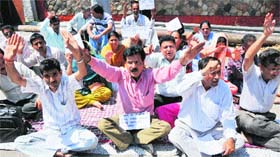 UP IN ARMS: Members of Jagti Tenement Committee stage protest against power cuts in Jammu on Wednesday