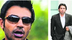 Former Pakistani captain Salman Butt (left) tells reporters in Lahore that he can return to international cricket after he and Mohammad Asif lost their appeals.  PTI 