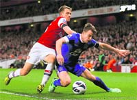 Arsenals Aaron Ramsey (left) tackles Evertons Seamus Coleman during their Premier League match in London on Tuesday evening.  AFP