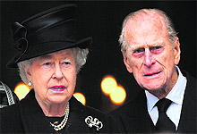 Margaret Thatcher's son Mark Thatcher and his wife Sarah sing a hymn during the funeral service, which was also attended by Queen Elizabeth and Prince Phillip
