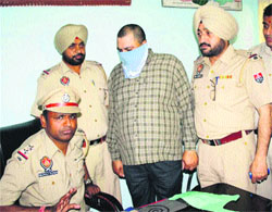 Parveen Kumar Sabarwal who was arrested by the police for impersonating as an SP-rank official of the BSF in Amritsar on Thursday