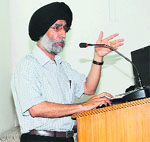 A speaker addresses the heritage conservation seminar at Khalsa College of Education on Thursday. 