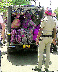 Women thieves being ferried to the Cantonment police station in an auto-rickshaw on Thursday