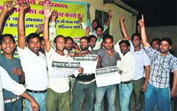 Residents of Mohalla Maidanian stage a protest in Haridwar on Thursday. Tribune photo: Rameshwar Gaur
