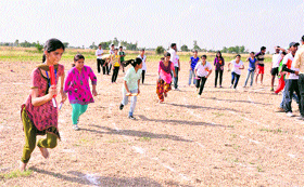 Girl students participate in a relay race at the three-day annual sports meet, organised by Shri Krishan Institute of Engineering and Technology, Kurukshetra.