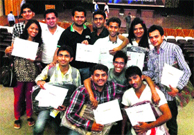 Jubilant HIT students show their certificates after the techno management fest.
