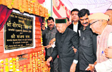 Chief Minister Virbhadra Singh lays the foundation stone of a government high school at Gummer in Jwalamukhi on Thursday. 