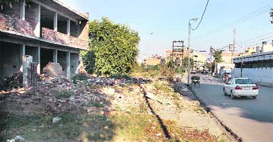 Shops on Basti Adda Road, which had to withdraw their boundaries following demolition to widen it in Jalandhar. Photo: Sarabjit Singh