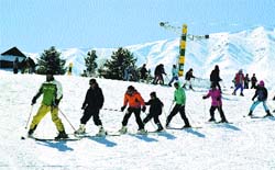 Children ski on a slope in Gulmarg tourist resort. A file photograph