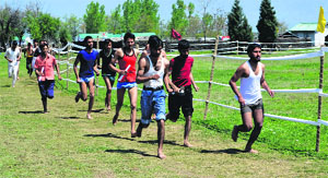 Youth take part in a recruitment rally organised by the Indian Army in Anantnag on Thursday. 